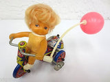 Vintage Mid Century Wind-Up Toy, Blond Girl Riding a Tricycle with Pink Balloon